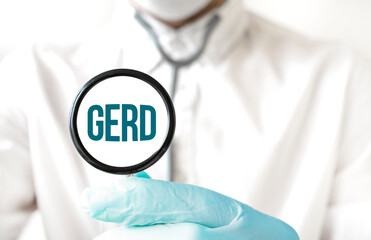 Doctor holding a stethoscope with text GERD, medical concept