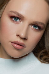 Fototapeta premium Portrait of beautiful woman model with fresh daily makeup and romantic wavy hairstyle