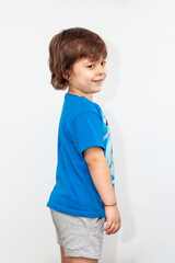 portrait of an emotional boy on a light background