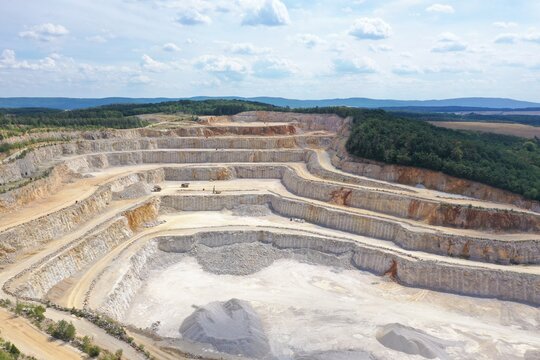 Drone aerial view of biggest Czech limestone quarry Devil's Stairs - Certovy Schody near Prague. Aerial view of industrial landscape after mining. Industry and environment in Czech Republic