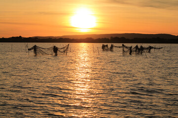 Fototapeta premium Beautiful sunset in the Fishing village of Villeneuve les Maguelone, a seaside resort in the south of Montpellier, Herault, France