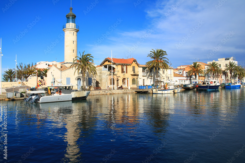 Wall mural lighthouse and old fishing port of grau du roi in camargue, a resort on the coast of occitanie regio