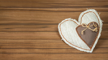 Handmade heart on wood background. Top view with copy space