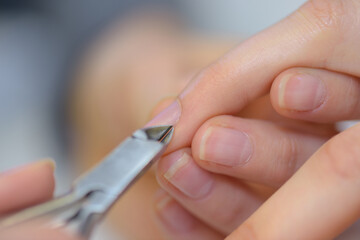 woman doing nail manicure