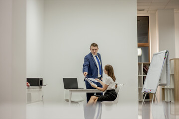Angry boss yelling at his young employee, she is stressed and feeling frustrated: hostile boss and...