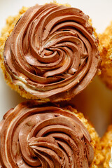 cake with chocolate. Small sweet tartlets with brown cream