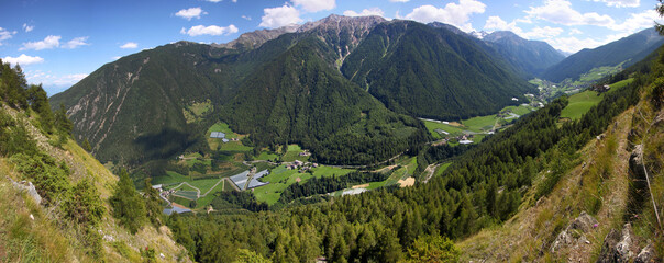 Panoramic view from Steinwand mountain trail with view down to Martell valley in the Alps with...