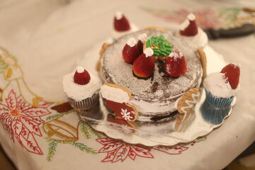 Christmas Cake with strawberries and cookies