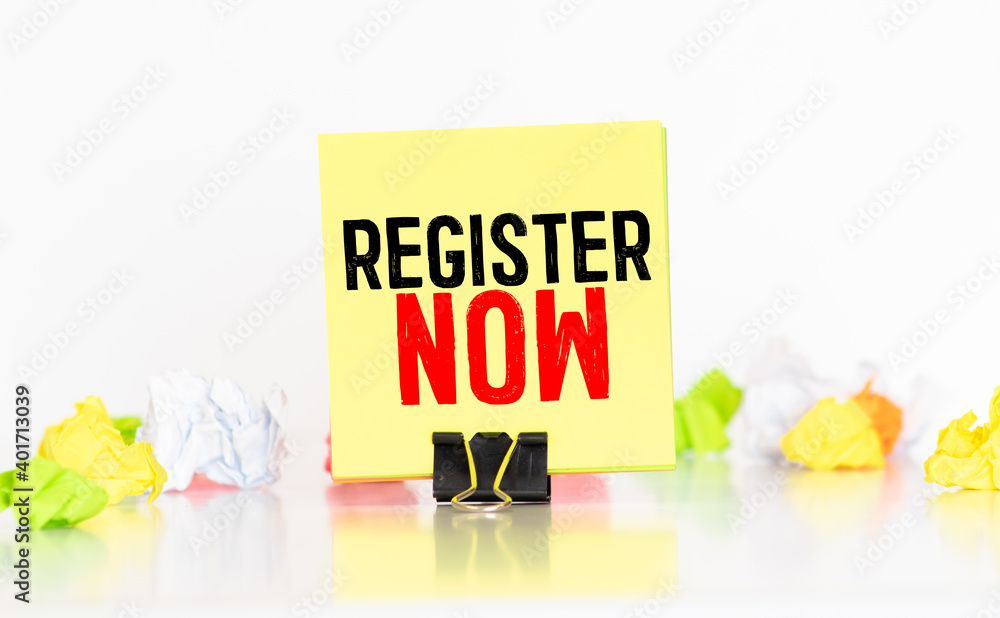 Poster memo with register now. memo with register now. on white keyboard