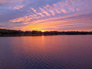 Sunset reflections in lake Rusalka in city Poznan, Greater Poland region.