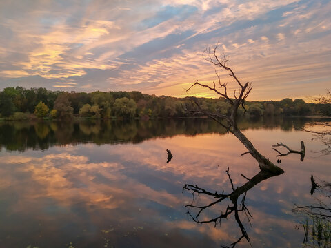 Sunset reflections in lake Rusalka in city Poznan, Greater Poland region.