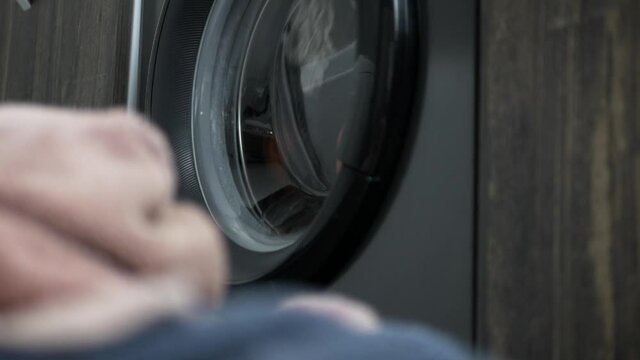 Wash clothes in a black washing machine
