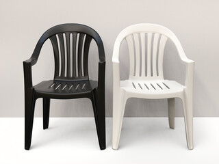 Black and white generic plastic chairs side by side