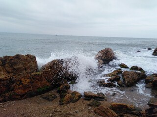waves crashing on rocks