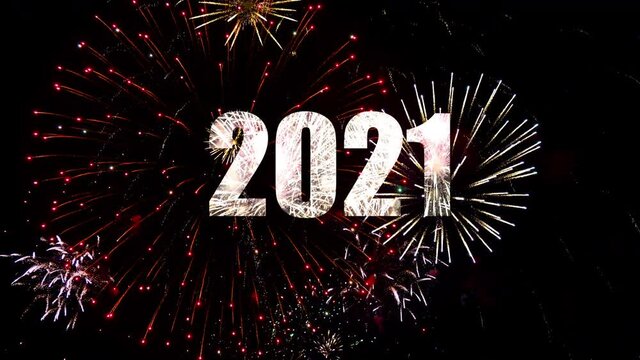 New year celebration of 2021 in midnight with sparkling fireworks and burining sparkles in the sky