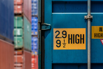 2.9 HIGH Text on Yellow Sign of Height of Blue Container's door
