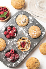 raspberry muffins in an oven tray