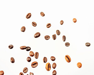 Falling coffee beans isolated on white background, clipping path, full depth of field. Cereal product. Hot drink. Close up. Harvesting. Natural background. Energy. Flying,horizontal orientation