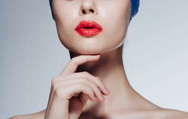 Woman with bared shoulders and red lips swimming cap for sports athlete