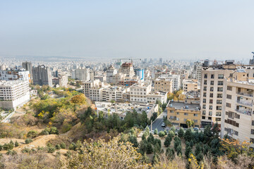 Fototapeta na wymiar City view of Tehran City with modern buildings, Iran , view form mountain Tochal climbing route.