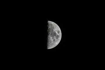 Photo of a half moon taken from Omaha Nebraska, USA