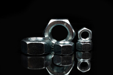 group of large metal nuts close up