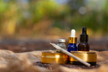 Fototapeta na wymiar Cannabis, hemp oil extract and capsules Medical herbs.