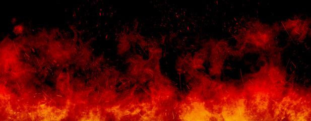 Fototapeta na wymiar Abstract image of Orange fire or flames with sparkles and smoke in black background.
