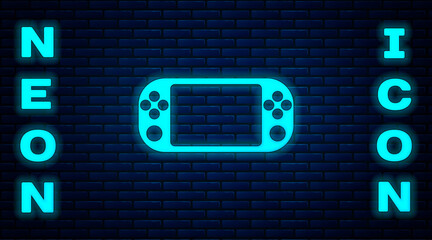 Glowing neon Portable video game console icon isolated on brick wall background. Gamepad sign. Gaming concept. Vector Illustration. © Kostiantyn