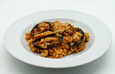 Risotto with seafood. Risotto ai frutti di mare, isolated on white background