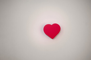 one red heart on a white background