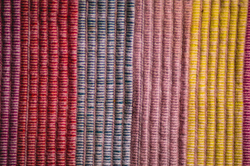 textured background  colored cotton threads vertical