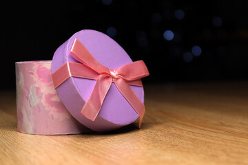 gift box with a bow on a blurred background bokeh lights