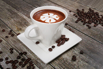 hot beverage coffee cappuccino white cup garnished with coffee beans 