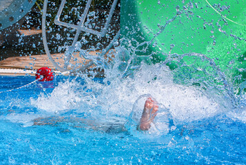 The man fell into the pool. Lots of splashes.