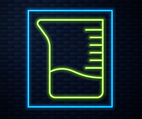 Glowing neon line Measuring cup icon isolated on brick wall background. Plastic graduated beaker with handle. Vector Illustration.