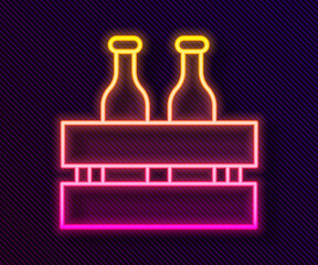 Glowing neon line Pack of beer bottles icon isolated on black background. Wooden box and beer bottles. Case crate beer box sign. Vector Illustration.