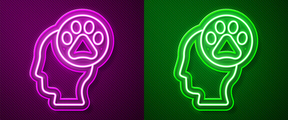 Glowing neon line Human head with animals footprint icon isolated on purple and green background. Pet paw in heart. Love to the animals. Vector.