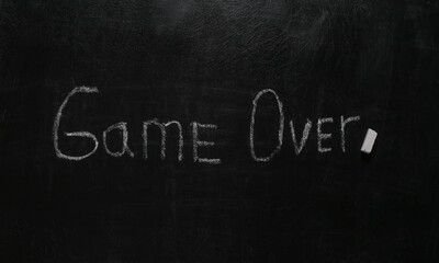 Word game over chalk hand drawn on blackboard