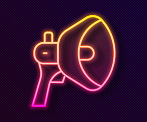 Glowing neon line Megaphone icon isolated on black background. Speaker sign. Vector.