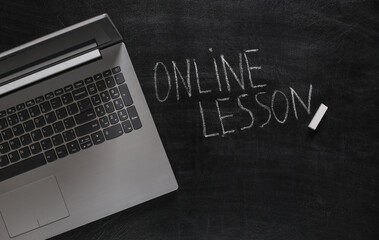 Laptop and Words online lesson chalk hand drawn on blackboard