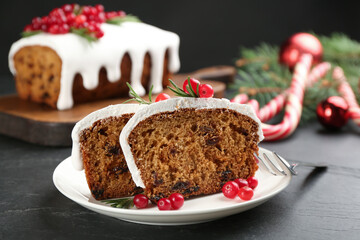 Traditional Christmas cake on black table, closeup. Classic recipe
