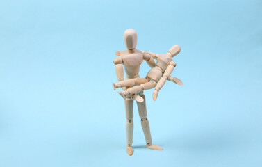 Family concept. Fatherhood. Spending time with children. Two puppet personified father and son are...