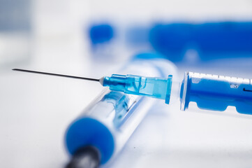 A single bottle vial of Covid-19 vaccine. Medical concept vaccination hypodermic injection...