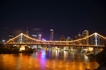 Fototapeta na wymiar Storey Bridge at night with reflections on Brisbane River, Queensland, Australia,