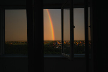Double rainbow in the morning on horisont above the area and ields