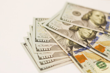 Stacks of paper 100 dollars USA on the white background