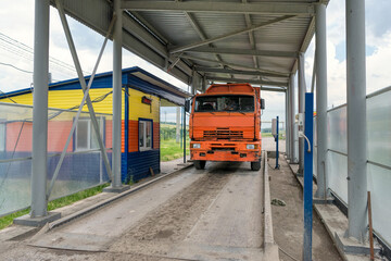 A garbage truck is weighed at a household waste recycling plant