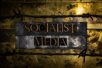 Socialist Media on grunge textured copper and gold background