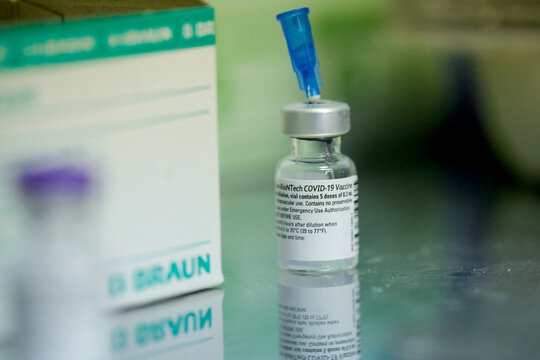 Shallow depth of field (selective focus) image with details of the Pfizer BioNTech vaccine in the hospital during the first day of vaccination.